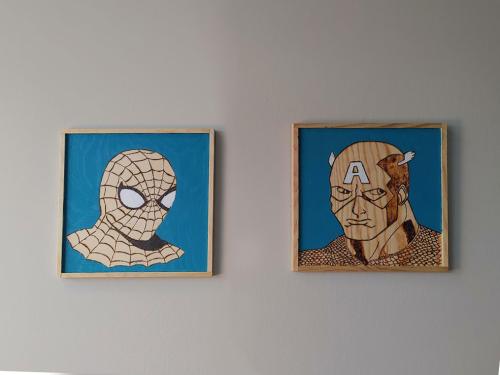 Spider-Man and Captain America wood burning. Painted.